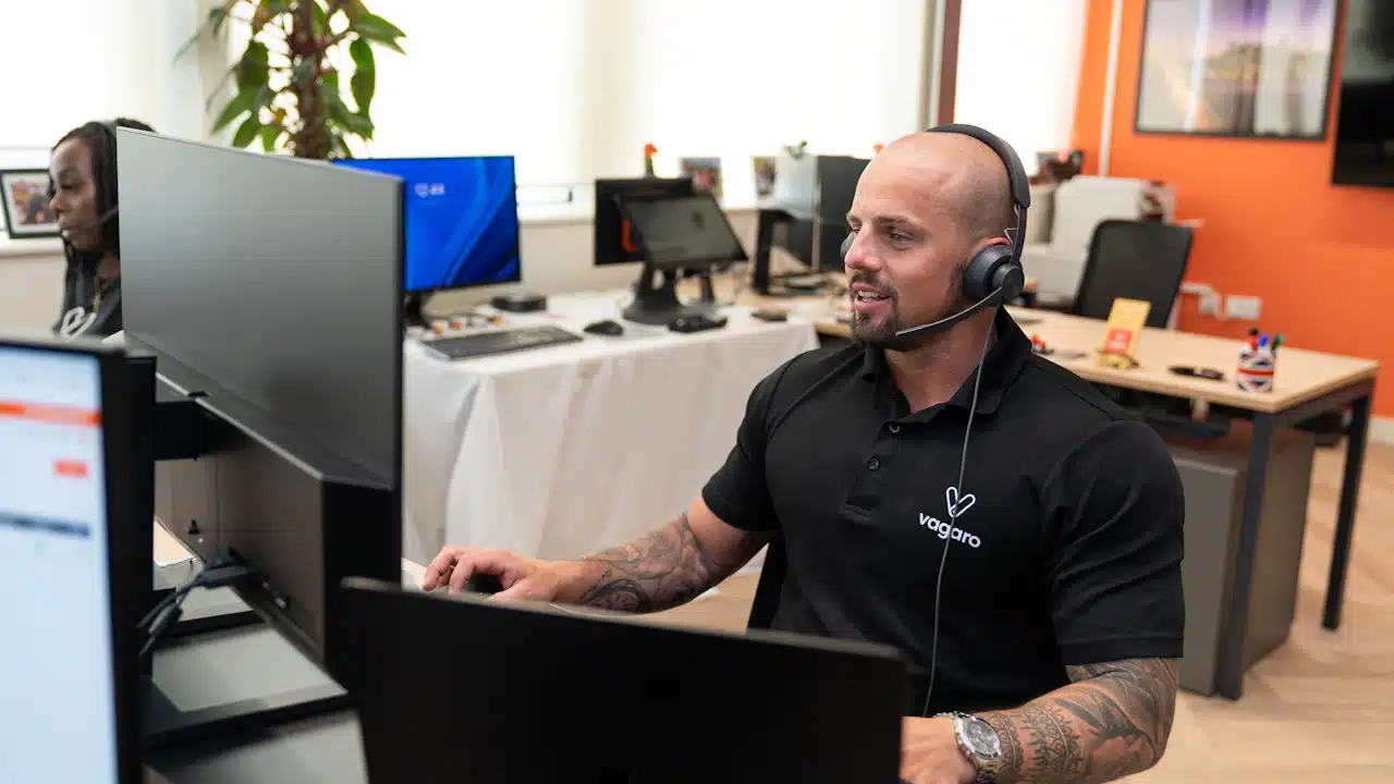 Technical support specialist at a computer illustrating help for Notch Content Intelligence users