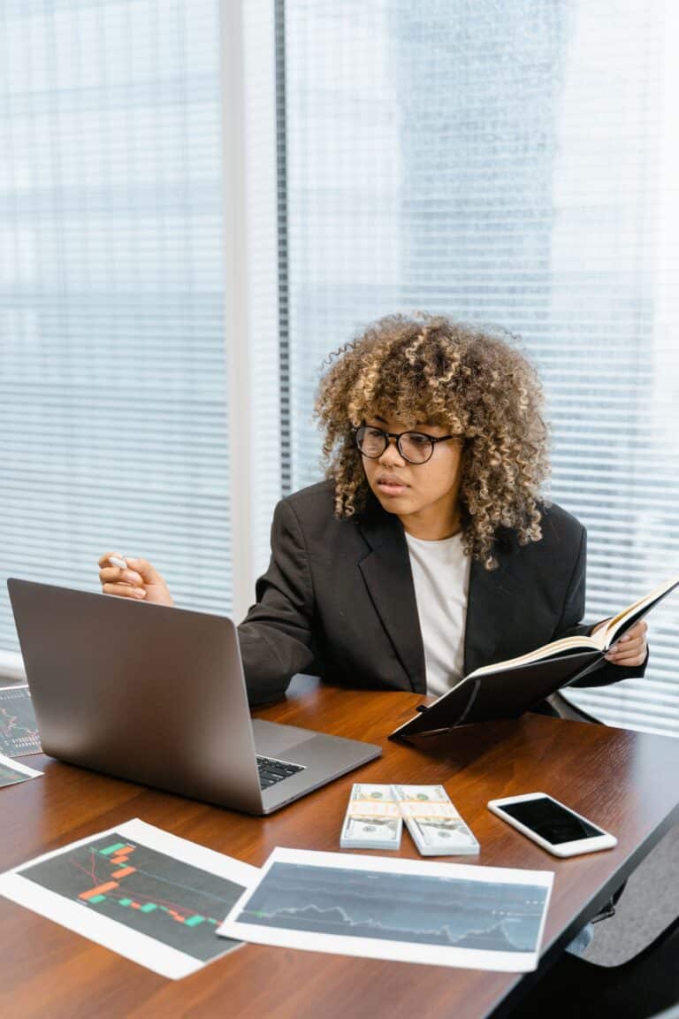 Marketing professional reviewing campaign tracking data and reports for consistent UTM governance